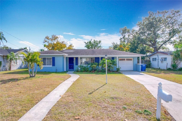 ranch-style house with a garage and a front lawn