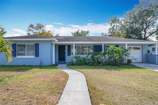 single story home with a garage and a front lawn