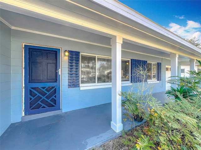 entrance to property with a porch