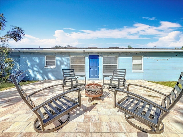 view of patio / terrace with an outdoor fire pit