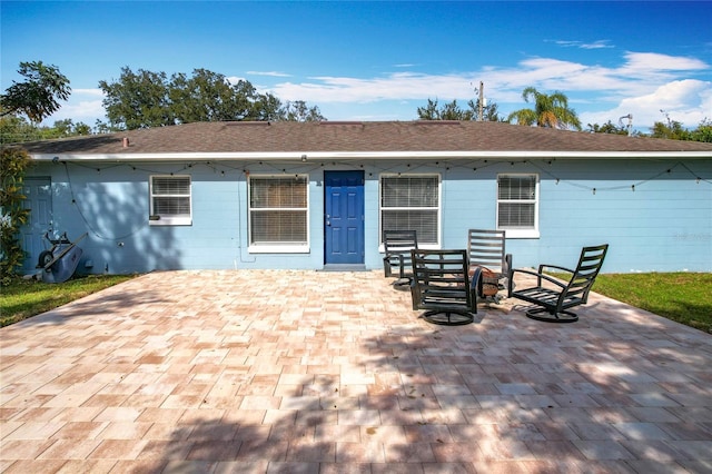 back of property with a patio area