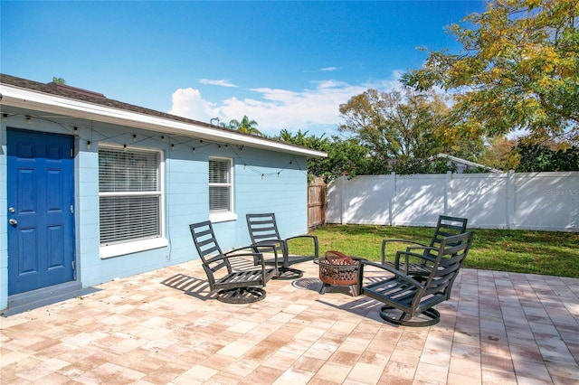 view of patio with a fire pit