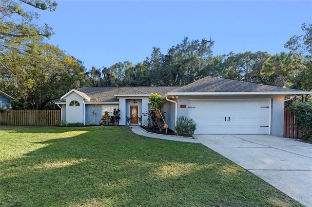 ranch-style house with a garage and a front lawn