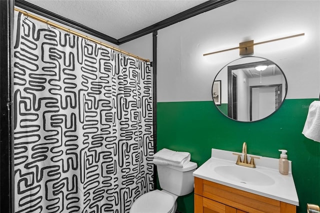 bathroom with walk in shower, toilet, a textured ceiling, ornamental molding, and vanity