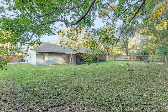 view of yard with a sunroom