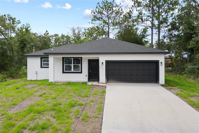 ranch-style house with a garage and a front yard