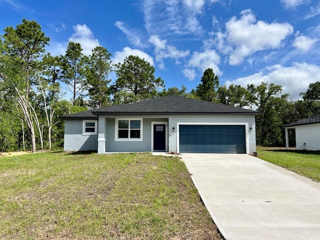 ranch-style home featuring stucco siding, an attached garage, driveway, and a front yard