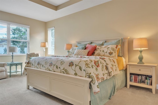 bedroom featuring light colored carpet