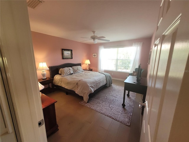 bedroom featuring hardwood / wood-style flooring and ceiling fan