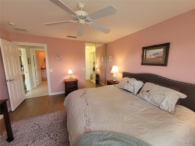 bedroom with wood-type flooring and ceiling fan