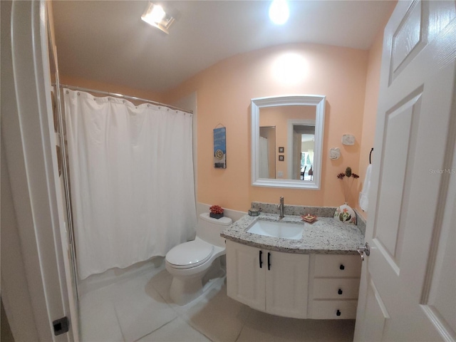 bathroom featuring vanity, toilet, and tile patterned flooring