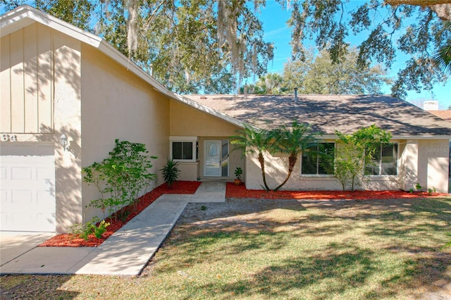 single story home featuring a front yard