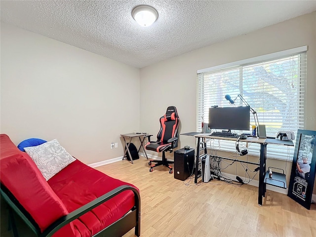 office featuring hardwood / wood-style floors and a textured ceiling