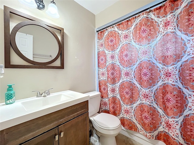 bathroom with vanity, toilet, and curtained shower