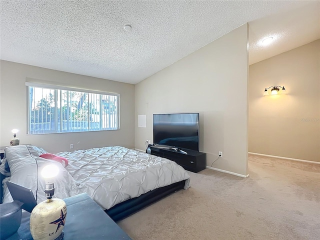 bedroom with vaulted ceiling, light carpet, and a textured ceiling