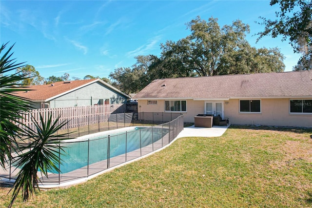 view of pool featuring french doors, a yard, and a patio