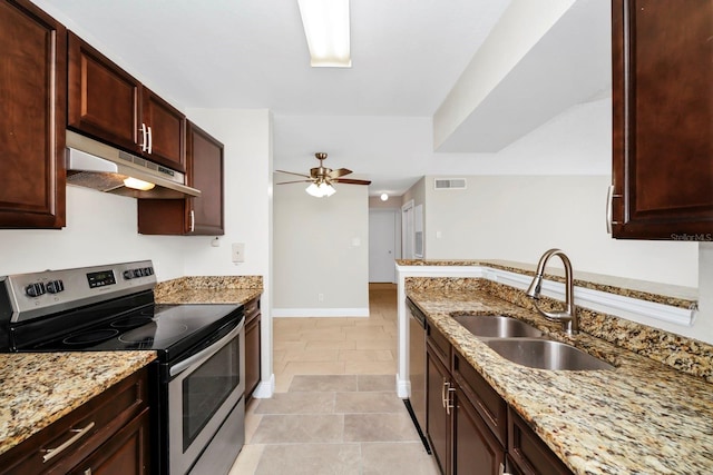 kitchen with appliances with stainless steel finishes, sink, light tile patterned floors, ceiling fan, and light stone countertops