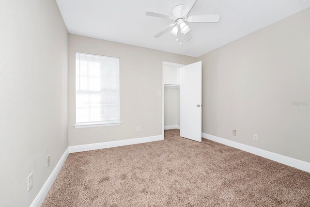 unfurnished bedroom with carpet floors and ceiling fan