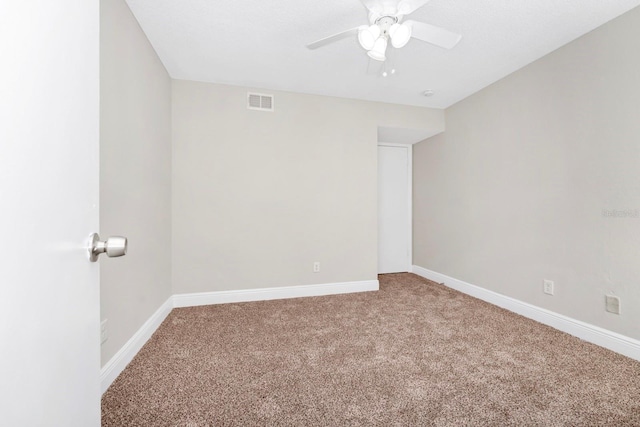 unfurnished room featuring carpet flooring and ceiling fan