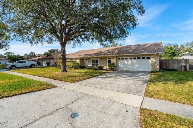 ranch-style house featuring a garage and a front yard