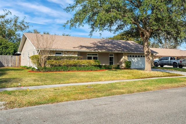 single story home with a garage and a front yard