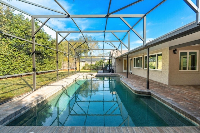 view of swimming pool featuring a patio area and glass enclosure