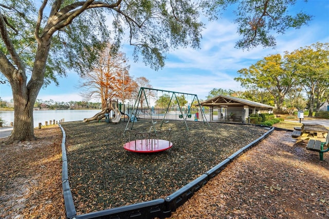 view of jungle gym with a water view