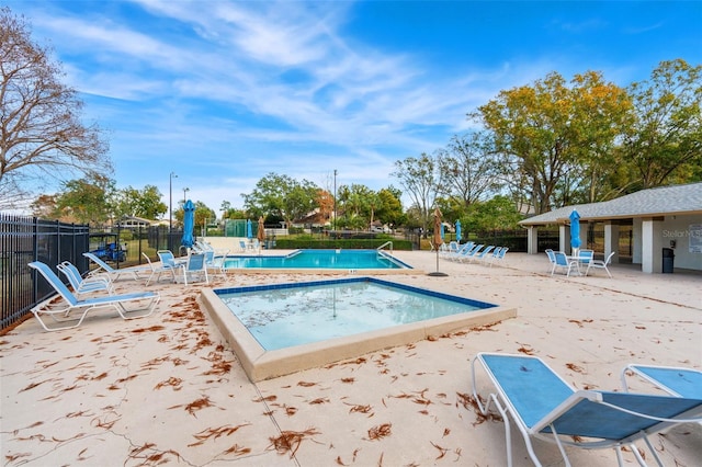 view of swimming pool featuring a patio area