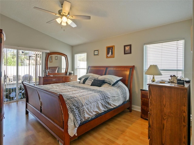 bedroom featuring ceiling fan, access to outside, vaulted ceiling, and light wood-type flooring