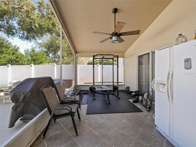 exterior space featuring ceiling fan