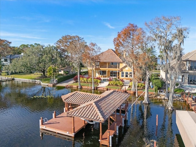 dock area featuring a water view and a balcony