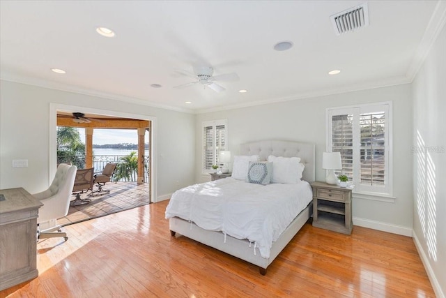 bedroom with ornamental molding, access to exterior, and light hardwood / wood-style floors