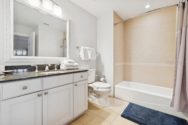 full bathroom with shower / tub combo with curtain, vanity, toilet, and tile patterned flooring