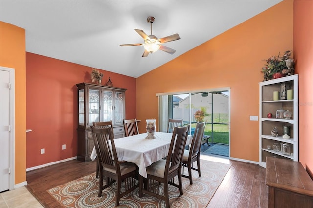 dining area with hardwood / wood-style flooring, vaulted ceiling, and ceiling fan