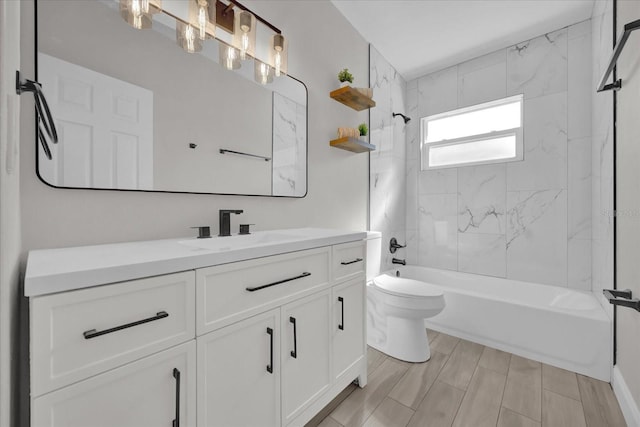 full bathroom with vanity, toilet, and tiled shower / bath combo