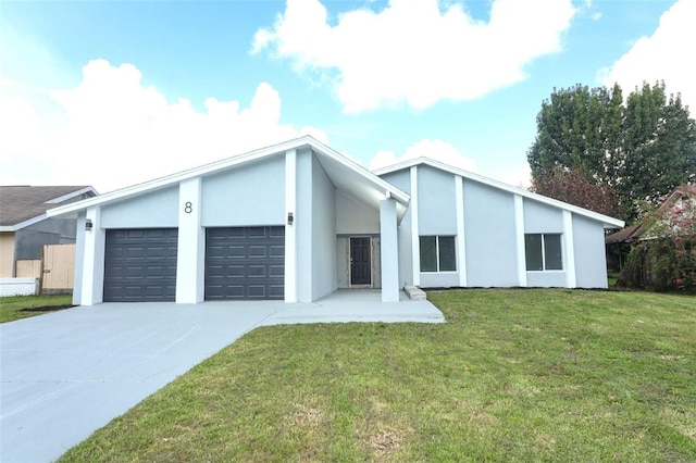 view of front facade featuring a garage and a front lawn