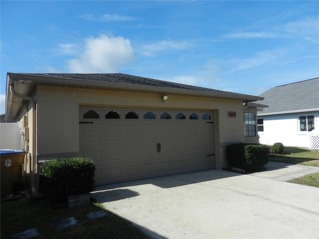 view of side of property with a garage