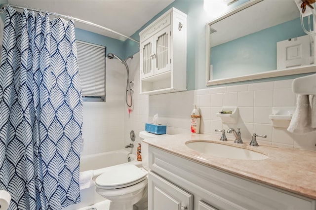 full bathroom with shower / tub combo with curtain, vanity, toilet, and tile walls