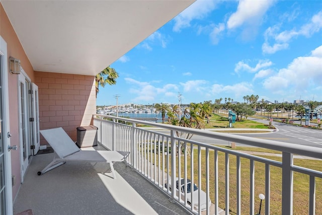 balcony featuring a water view