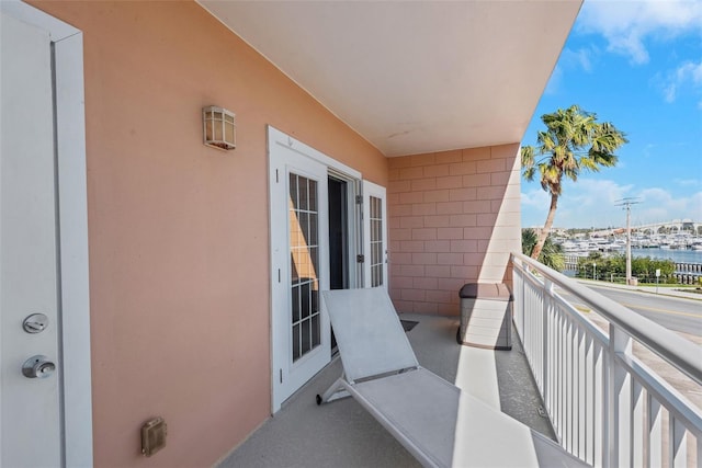 balcony featuring a water view