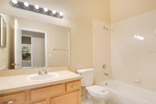 full bathroom with vanity, toilet, and tiled shower / bath combo