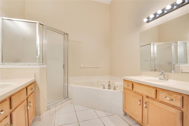 bathroom featuring vanity, tile patterned floors, and shower with separate bathtub