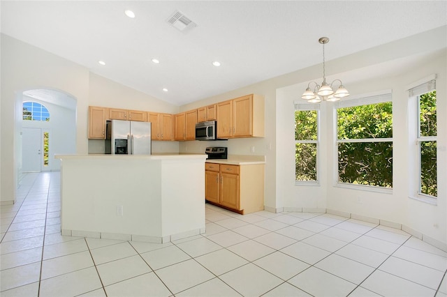 kitchen with a healthy amount of sunlight, visible vents, light countertops, and appliances with stainless steel finishes
