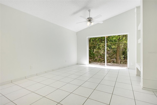 unfurnished room with light tile patterned floors, ceiling fan, a textured ceiling, and lofted ceiling