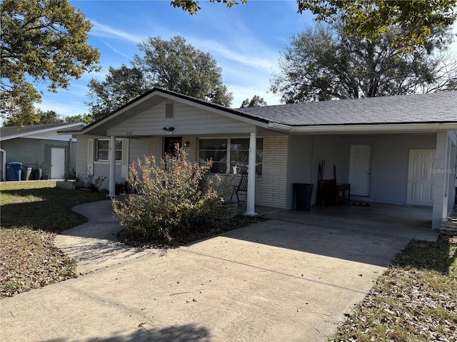 view of front of property with a carport