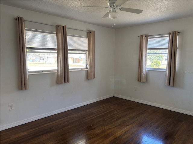 unfurnished room featuring ceiling fan, dark hardwood / wood-style floors, and a textured ceiling