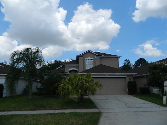 view of front of home featuring a garage and a front lawn