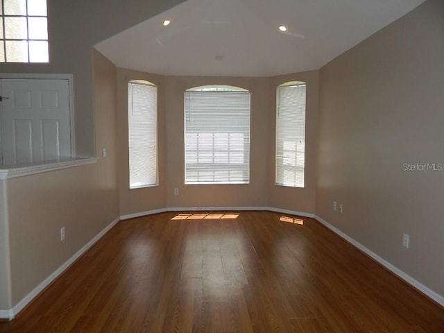 empty room featuring dark wood-type flooring