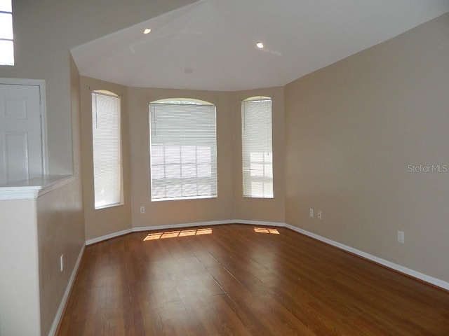 spare room with hardwood / wood-style floors