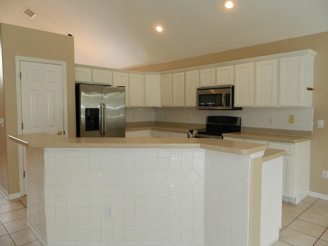 kitchen featuring stainless steel appliances, white cabinetry, a center island with sink, and light tile patterned floors